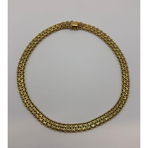 614 - An 18 carat gold fancy necklace, two rows of offset textured 'x' links enclosed by polished oval lin... 