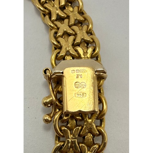 614 - An 18 carat gold fancy necklace, two rows of offset textured 'x' links enclosed by polished oval lin... 