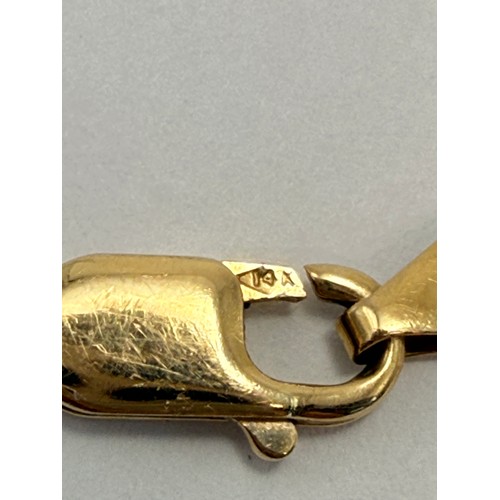  An Italian tri-coloured gold jewellery suite comprising a flat link braided necklace and bracelet, t... 