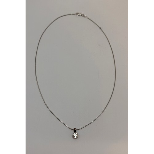  An 18 carat white gold diamond pendant necklace, the round stone in an openwork pendant mount, both ... 
