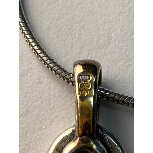  An 18 carat white gold diamond pendant necklace, the round stone in an openwork pendant mount, both ... 