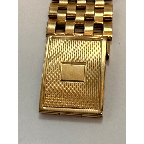  A 9 carat gold bracelet strap wristwatch, the silvered square dial signed ROTARY MAXIMUS, with gilt ... 