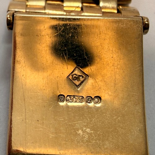  A 9 carat gold bracelet strap wristwatch, the silvered square dial signed ROTARY MAXIMUS, with gilt ... 
