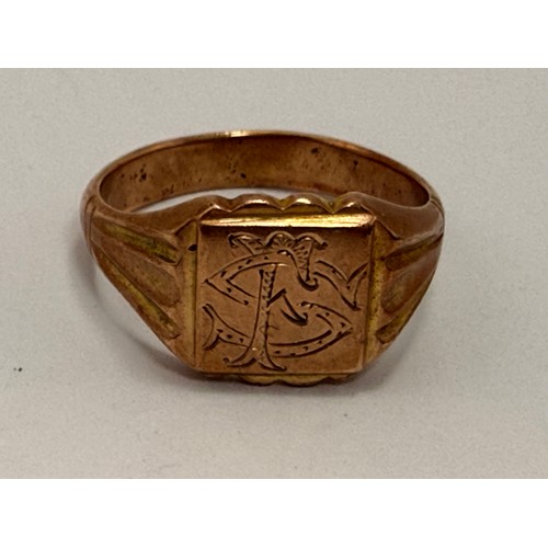 621 - A rose gold signet ring, the scalloped square matrix engraved with a monogram, to reeded tapering sh... 