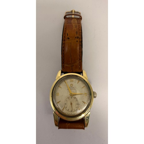 623 - A gent's gold-plated Omega Automatic Chronometre strap watch, the silvered circular dial signed, wit... 