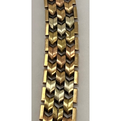  A 9 carat tri-colour gold modernist bracelet, with textured chevron links, hallmarked Birmingham 197... 