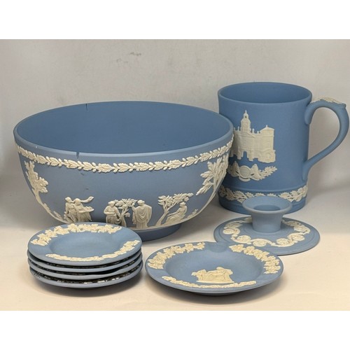  A collection of seven pieces of wedgwood blue jasperware including large bowl (a/f) candle tick hold... 