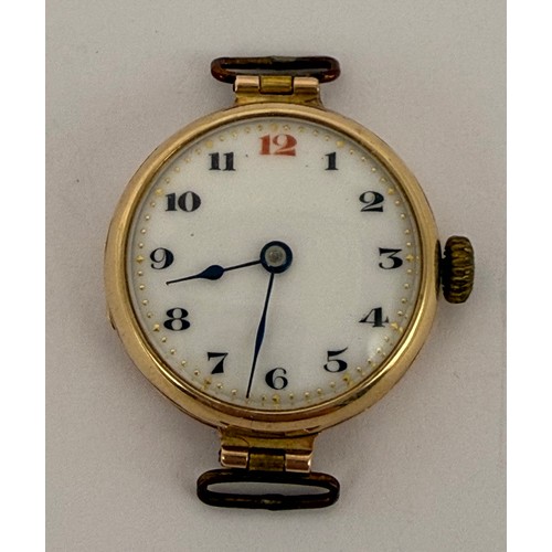  A 9 carat gold watch head, the circular white enamel dial with Arabic numerals and blued steel hands... 