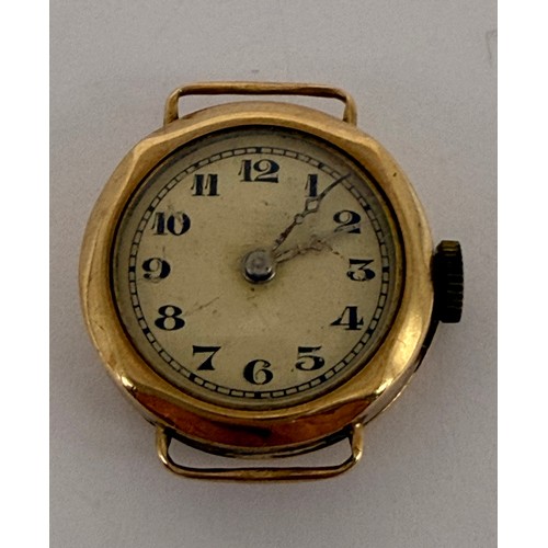  A 9 carat gold watch head, the circular white enamel dial with Arabic numerals and blued steel hands... 