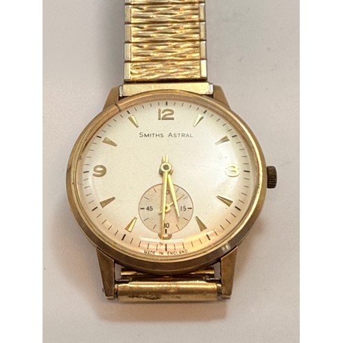  A gent's 9 carat gold-cased Smiths Astral wristwatch, the white circular dial with gilt metal Arabic... 