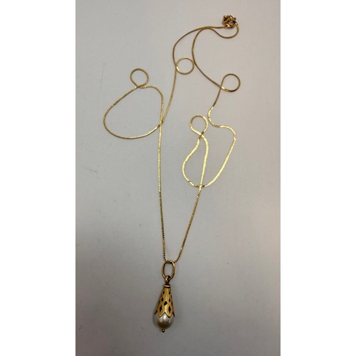 640 - A pearl pendant with textured and pierced conical gold mount to a fine flat s-link chain, both stamp... 