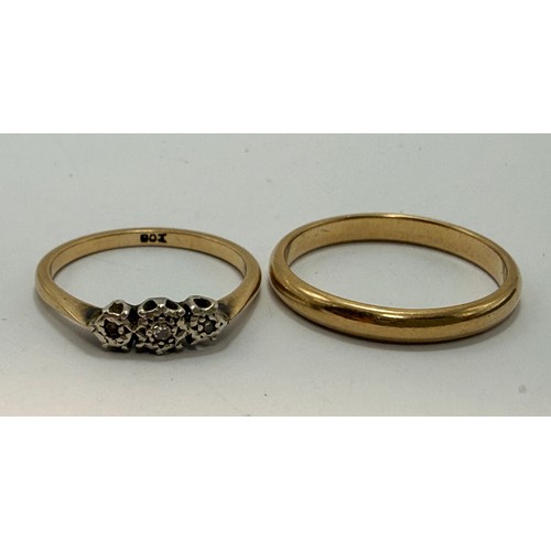 642 - A 9 carat gold wedding band, hallmarked Birmingham 1988, ring size S1/2; together with a three-stone... 