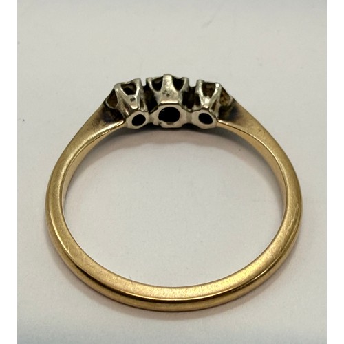 642 - A 9 carat gold wedding band, hallmarked Birmingham 1988, ring size S1/2; together with a three-stone... 