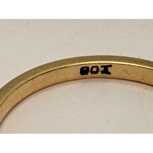 642 - A 9 carat gold wedding band, hallmarked Birmingham 1988, ring size S1/2; together with a three-stone... 