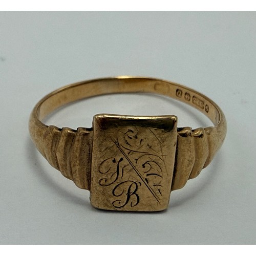 A 9 carat gold signet ring, the rectangular matrix engraved with foliage and initials, to stepped sh... 