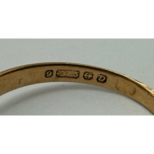  A 9 carat gold signet ring, the rectangular matrix engraved with foliage and initials, to stepped sh... 