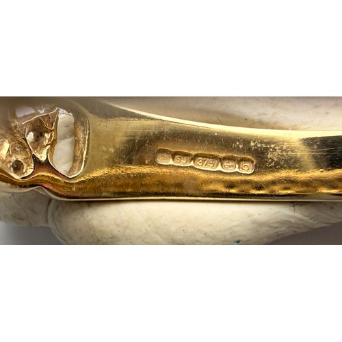  A 9 carat gold signet ring, the rectangular matrix engraved with foliage and initials, to stepped sh... 