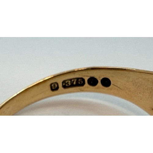  A gent's 9 carat gold solitaire signet ring, the cushion-shaped matrix gypsy-set with a small diamon... 