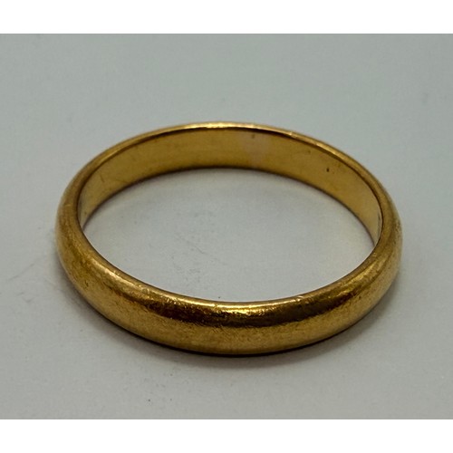600 - A 22 carat gold wedding band, hallmarked Birmingham 1930. Ring size N1/2, 3.7g
