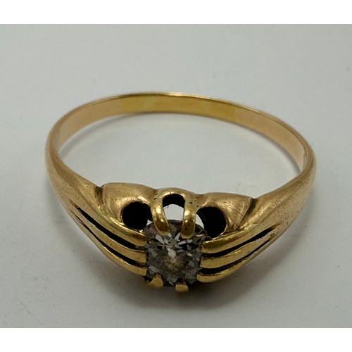  A gent's 18 carat gold solitaire diamond ring, the round brilliant cut diamond claw-set to a flush o... 