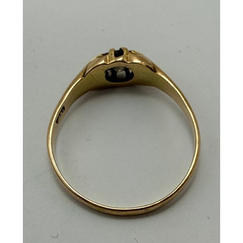  A gent's 18 carat gold solitaire diamond ring, the round brilliant cut diamond claw-set to a flush o... 