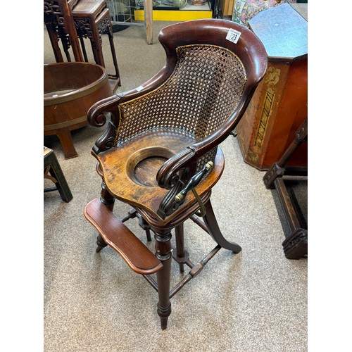 723 - An Antique convertible high chair with bergère back
