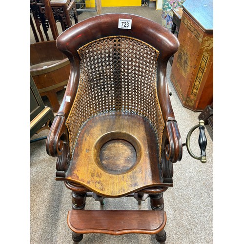 723 - An Antique convertible high chair with bergère back