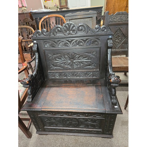 805 - A Jacobian style antique carved Monk's Bench with hinged seat 83cm wide x 45cm deep x 103cm high