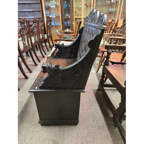 805 - A Jacobian style antique carved Monk's Bench with hinged seat 83cm wide x 45cm deep x 103cm high