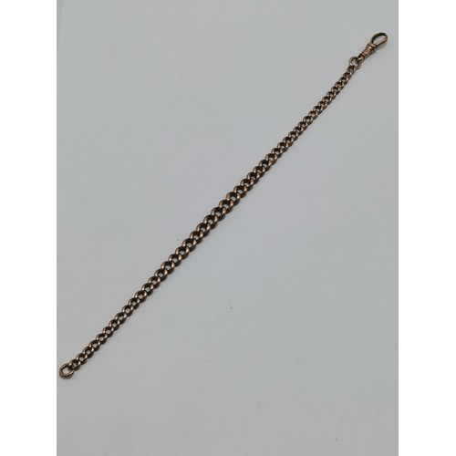 681A - A 9 carat rose gold graduated curb link watch chain, each link stamped '9.375', with dog clip. 23.5c... 