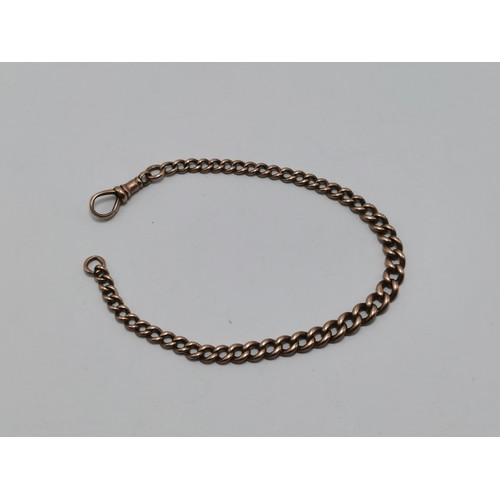 681A - A 9 carat rose gold graduated curb link watch chain, each link stamped '9.375', with dog clip. 23.5c... 