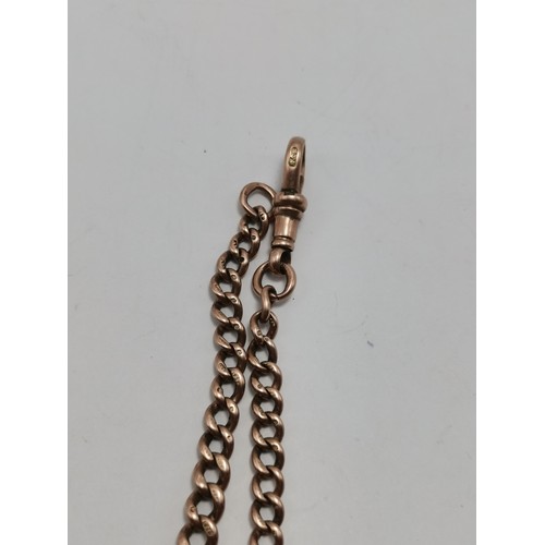 681A - A 9 carat rose gold graduated curb link watch chain, each link stamped '9.375', with dog clip. 23.5c... 
