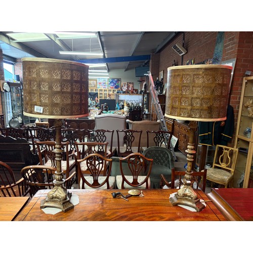 818 - A pair of gilt composite table lamps with pierced metal shades 75.5cm high

Good: In good condition ... 
