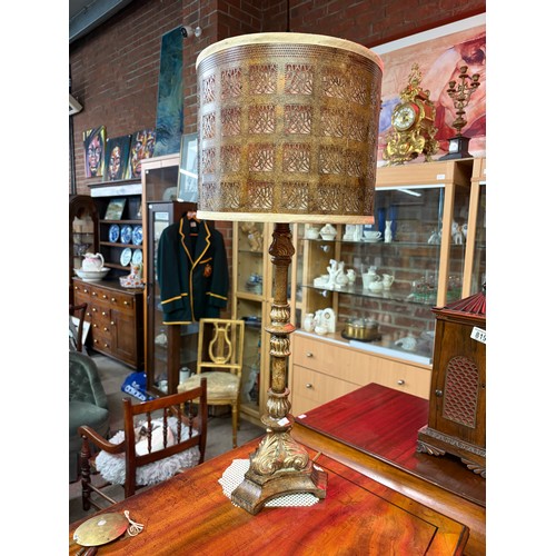 818 - A pair of gilt composite table lamps with pierced metal shades 75.5cm high

Good: In good condition ... 