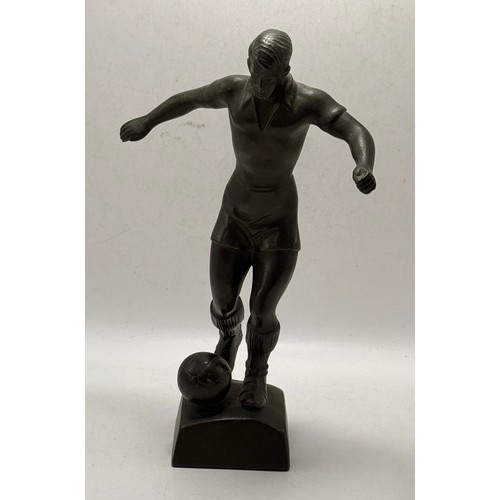 214 - A Collection of three football figurines of various medians. Two bronze,  and one resin