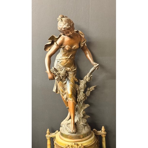 4 - French Belle Epoque mantel clock.  Featuring a painted bronze or spelter figurine holding flowers, o... 