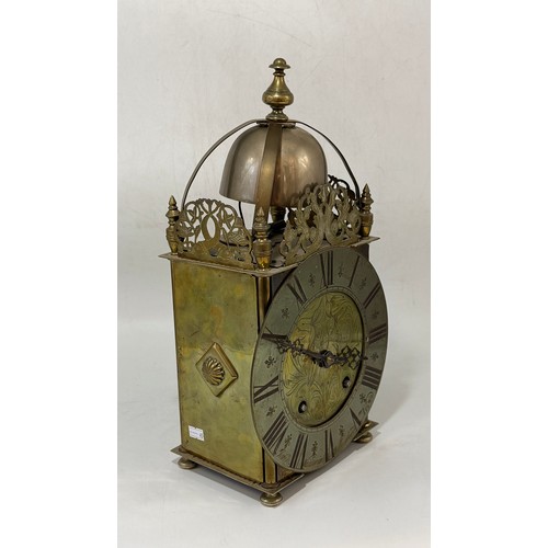 16 - An antique Brass Lantern Clock with French movement replacement, dial inscribed John Wainwright, Wel... 