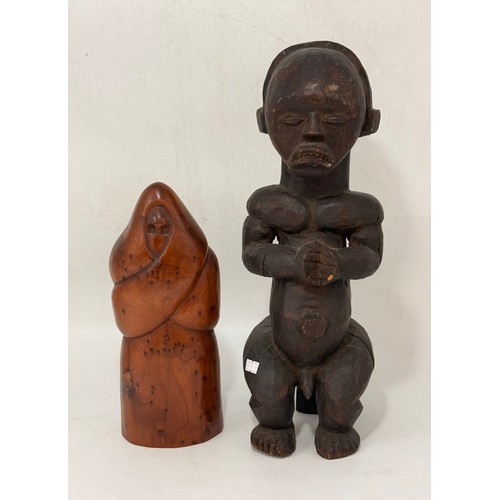 29 - Two wooden sculptures - A carved Thuya burl wood monk style plus carved African power figure