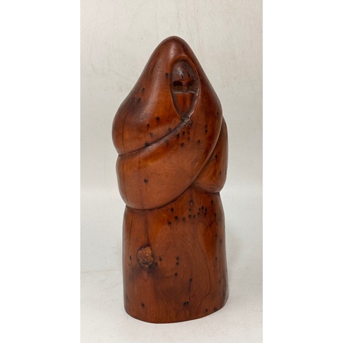 29 - Two wooden sculptures - A carved Thuya burl wood monk style plus carved African power figure