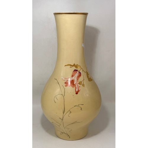 18 - Large porcelain blushed ivory vase.  Hand painted floral motifs with raised gilded accents.  H 61cm