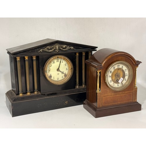 37 - Two Clocks.  An Antique ebonized Victorian mantel clock with pillar supports By Ansonia clock compan... 