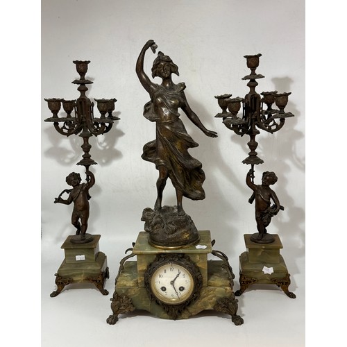 21 - French Art Nouveau Mantel Clock and Garniture set.  The bronze depicting 