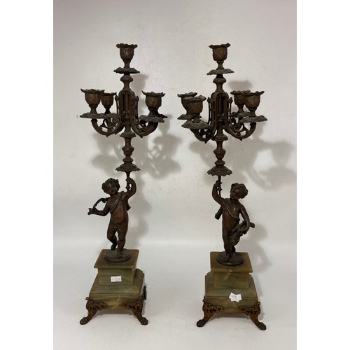 21 - French Art Nouveau Mantel Clock and Garniture set.  The bronze depicting 