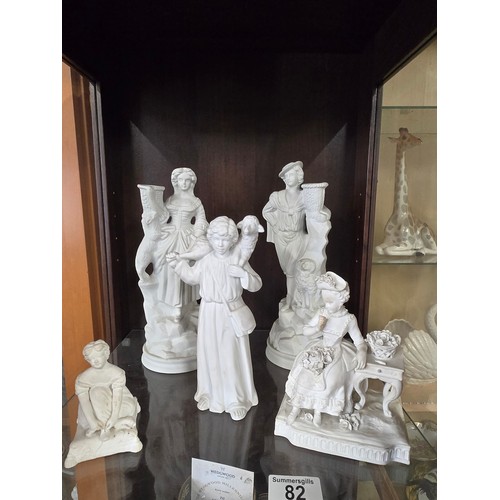 82 - A collection of 5 white Bisque figurines including x2 Portmeirion parian candlesticks