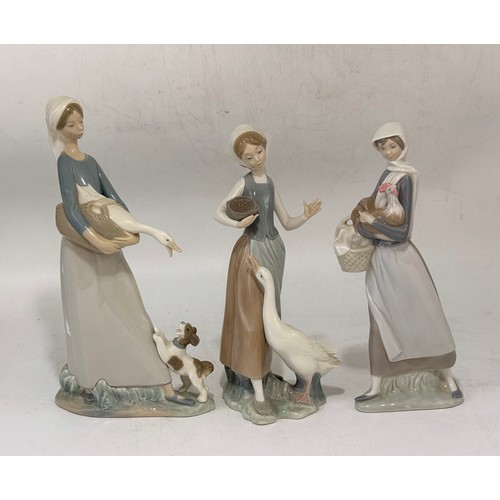 189 - A group of three Lladro figurines.  