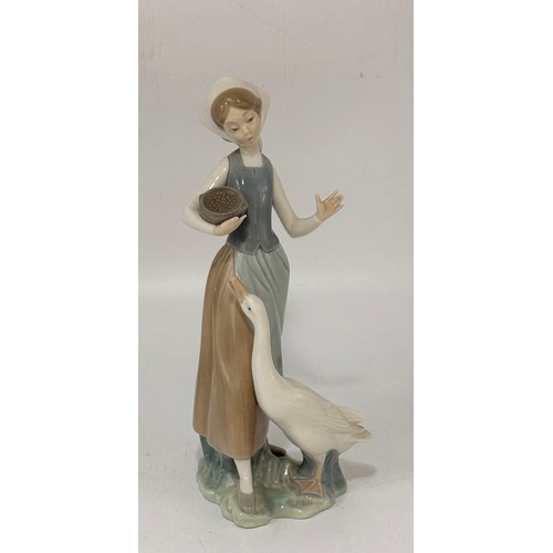 189 - A group of three Lladro figurines.  
