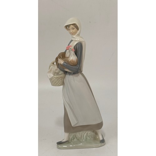 189 - A group of three Lladro figurines.  