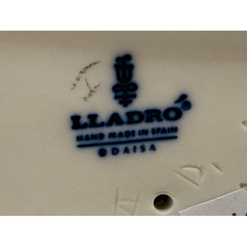 189 - A group of three Lladro figurines.  