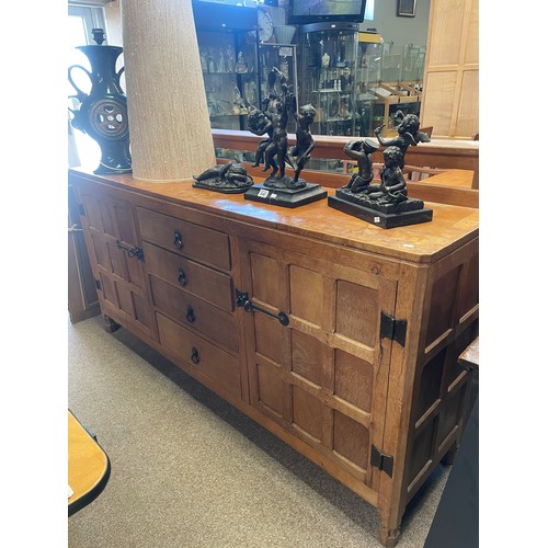 639 - Trevor Hutchinson, a Squirrelman oak dresser and plate rack, adzed, with two cupboards and four draw... 