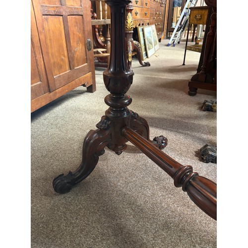 613 - An antique mahogany hall table of serpentine outline on heavily carved supports 96cm wide x 50cm dee... 